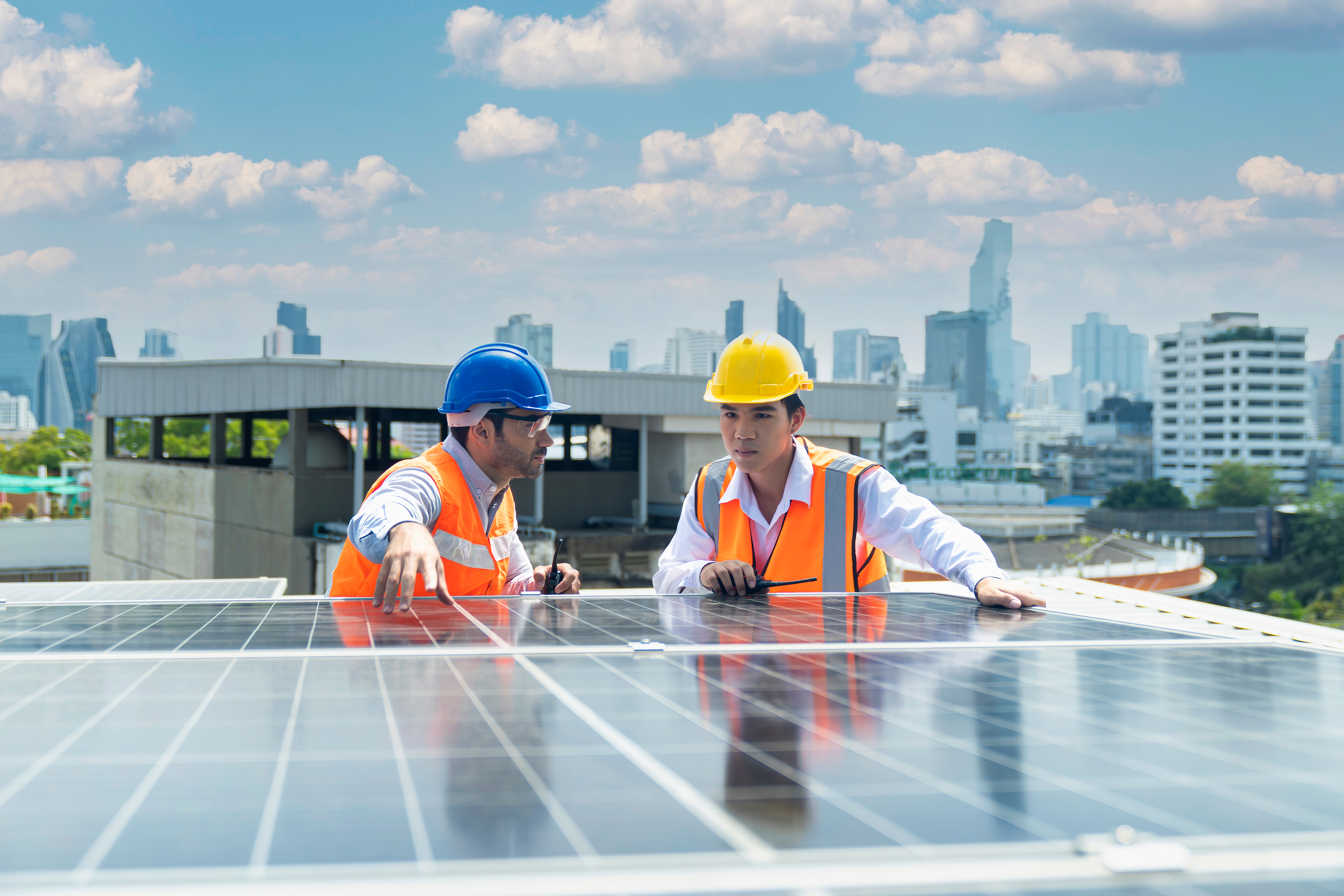 Solar panel technician on roof